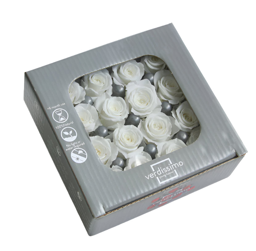 Sixteen white mini rose heads in a box
